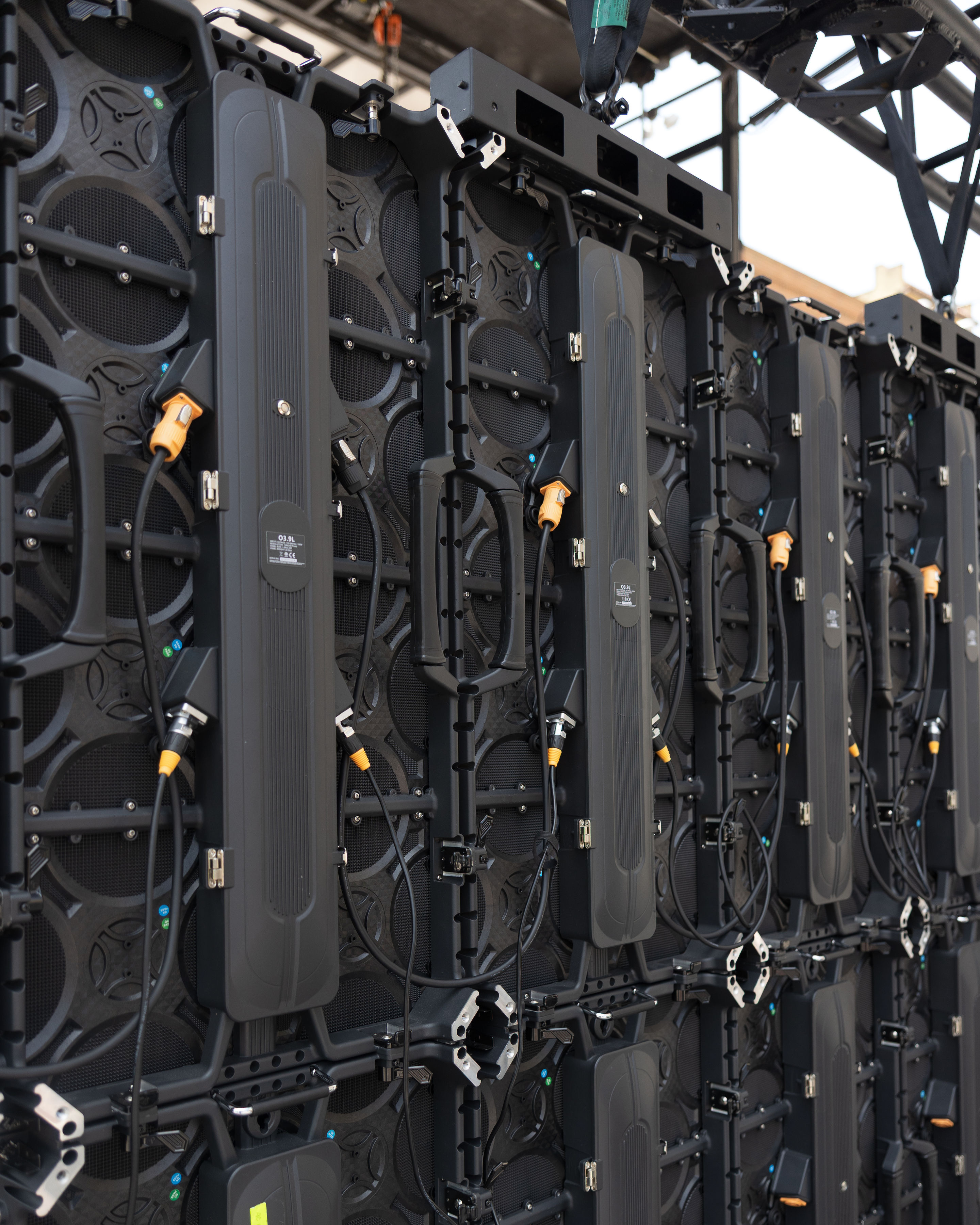Line array speaker cabinets rigged and ready