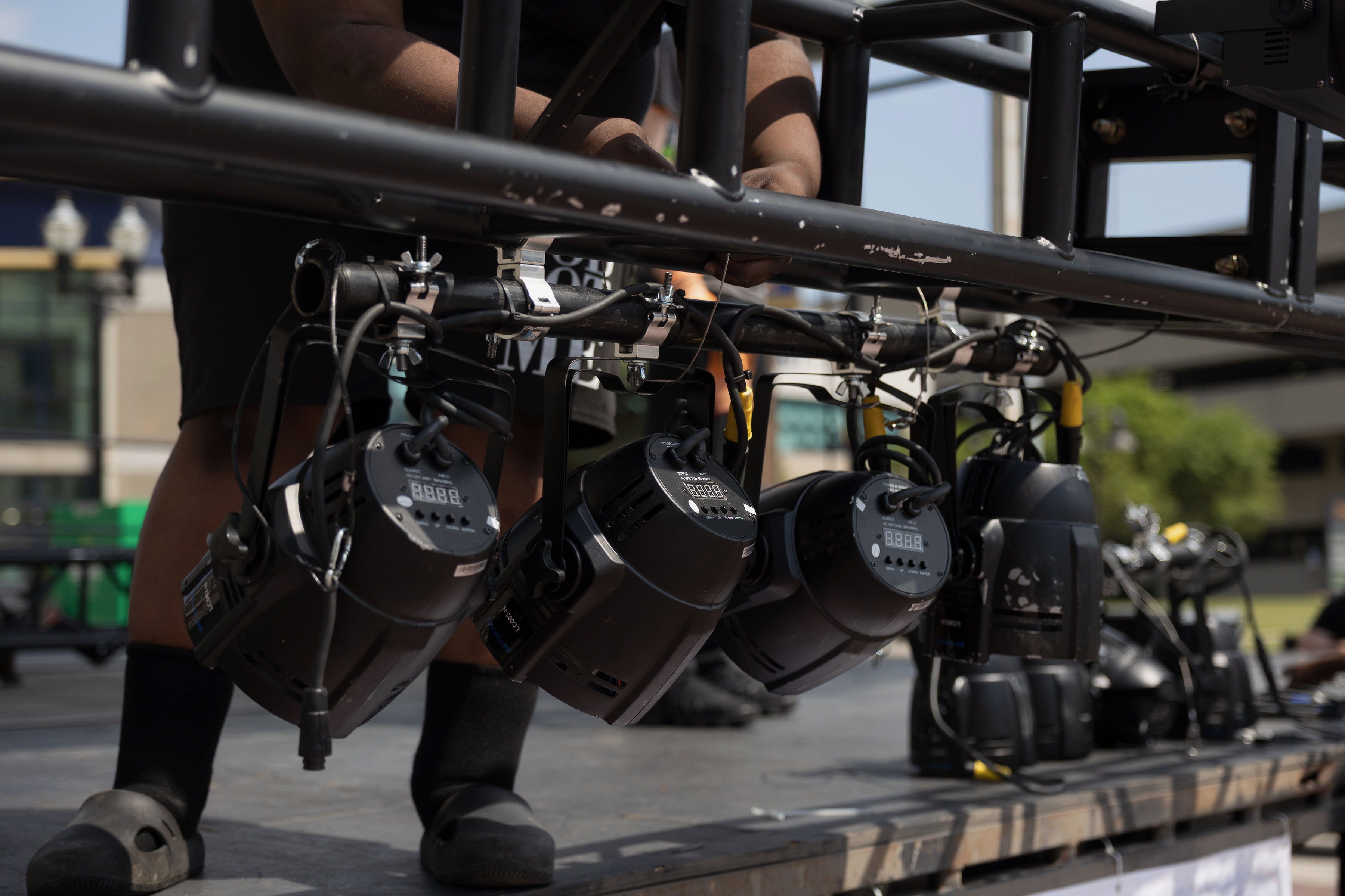 Crew member carrying a road case near the stage